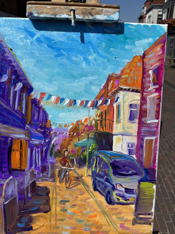 Festive Dutch town scene with cyclist