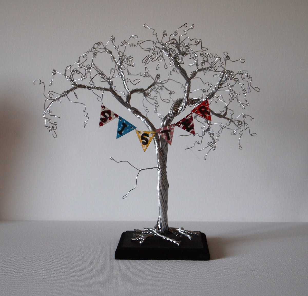 Silver wire tree sculpture with SISTER bunting by Steph Morgan