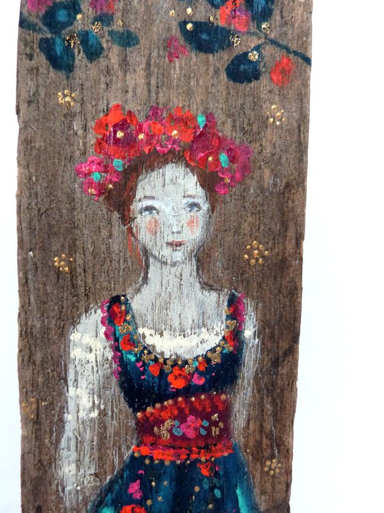 Totem sculpture Slavic woman on painted wood.