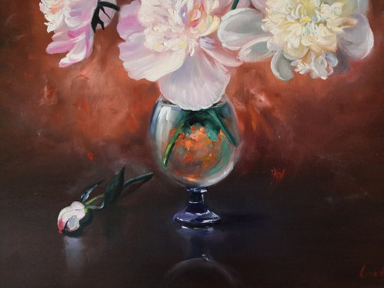 Peonies bouquet in a glass vase