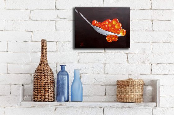 Red caviar in the spoon. Still life