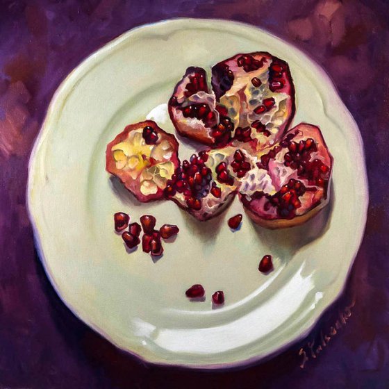 pomegranate on a white plate