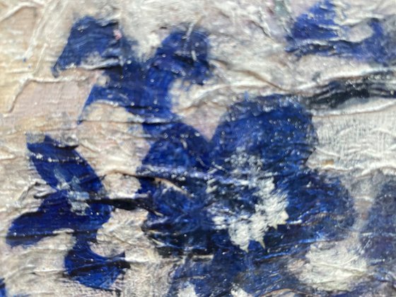 Lilies in a blue and white vase