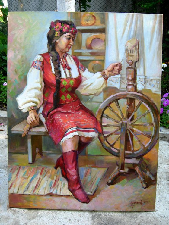 The girl at the spinning wheel. Portrait Ukrainka