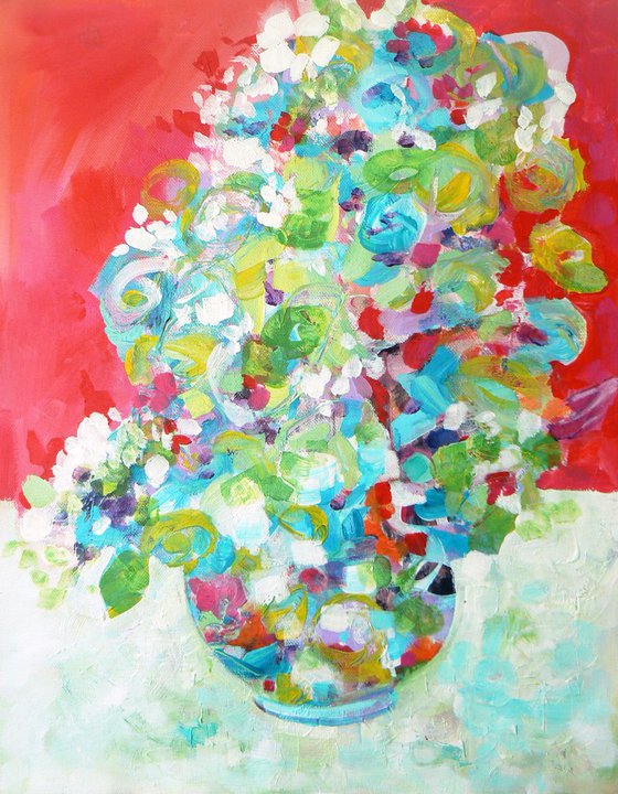 Vase of flowers on red