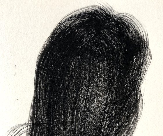 A woman with long hair sitting