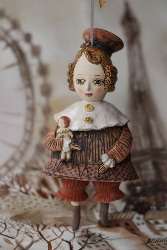 Vintage girl with a doll. From "Le Carousel, Hommage à l'Innocence" project by Elya Yalonetski