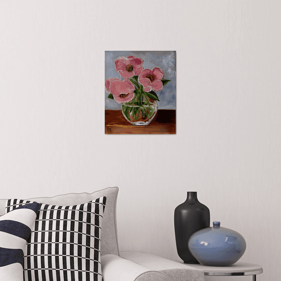 Bouquet of wild coral roses in a vase.