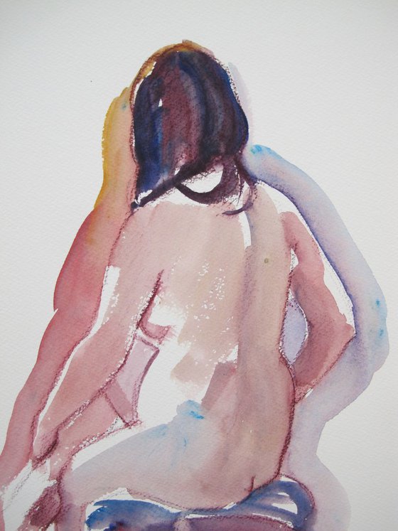 Seated female nude back view