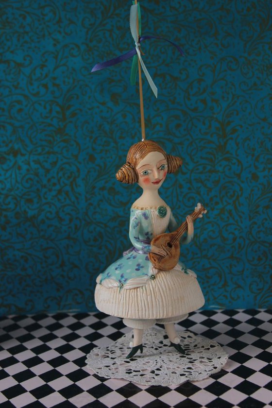 Girl with a mandoli. Ceramic hanging sculpture