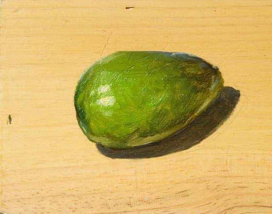 green avocado on a wood board for food lovers