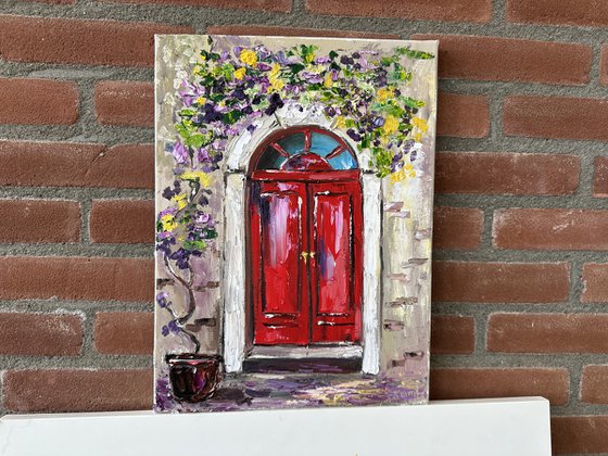 Red door with flowers