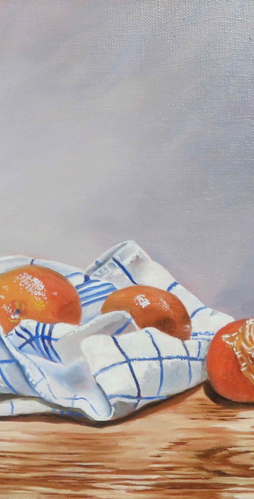 Clementines and tea-towel by Anne Zamo