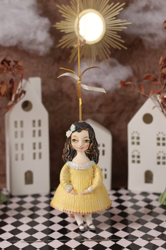 Little Girl in Yella. Hanging sculpture, bell doll by Elya Yalonetski