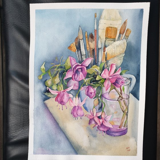 Fushia flowers on painter's table