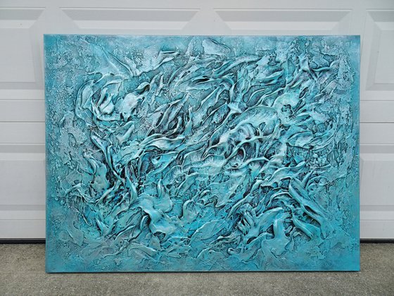 Canvas coated with aqua blue and grey acrylic paint with texture