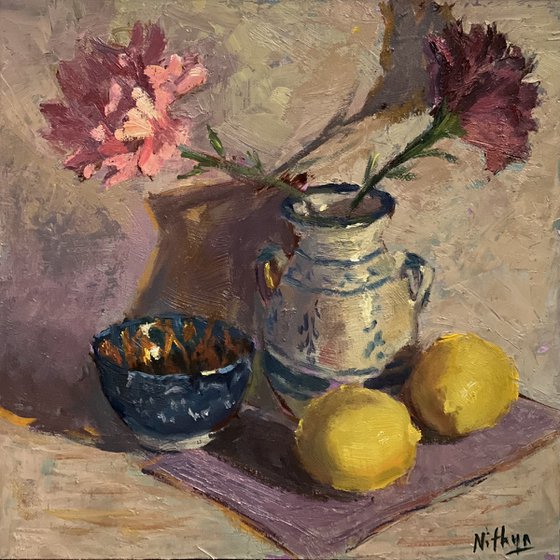Lemons and flowers with a vase