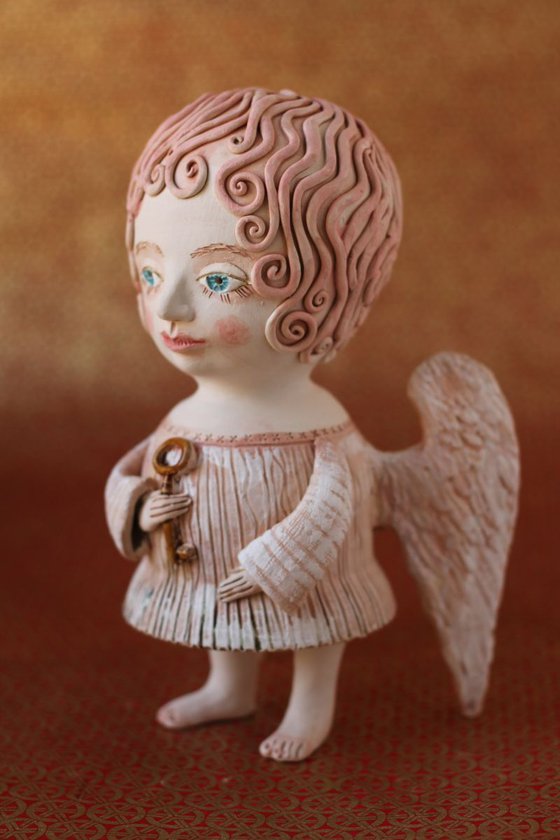 Angel holding a key. Ceramic OOAK sculpture by Elya Yalonetski