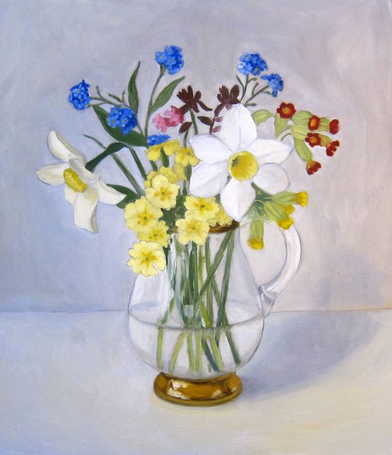 Spring flowers in glass jug