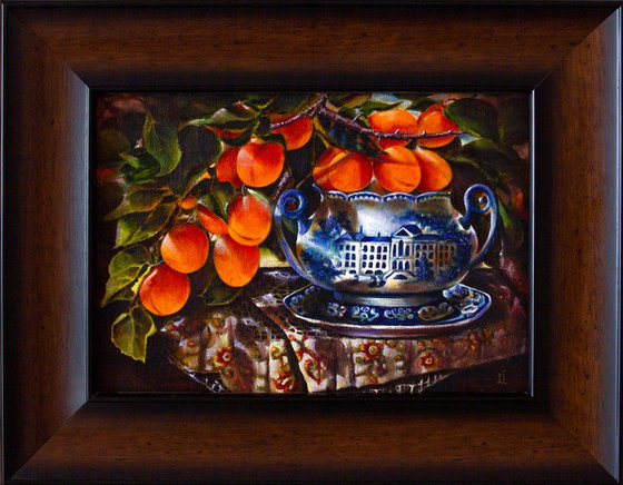 Apricot branch in a porcelain bowl