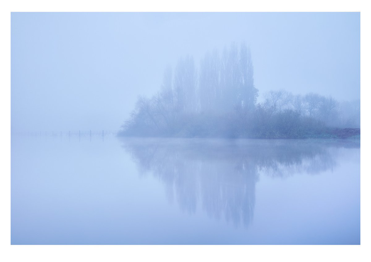 Misty Trees Reflection by Douglas Kurn