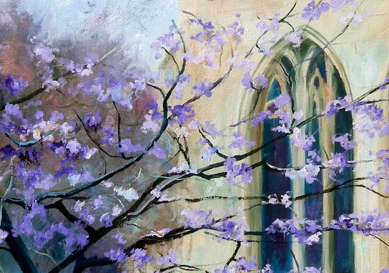 Peterborough cathedral with purple blossom