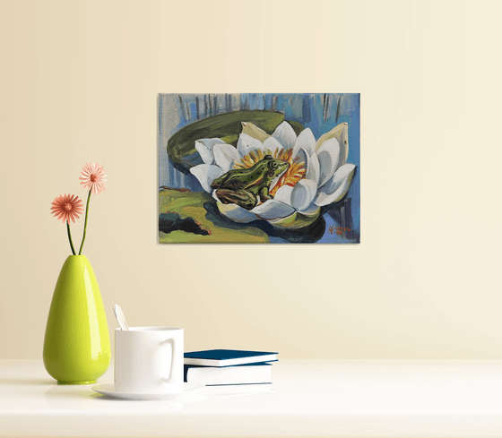 The Frog Princess. Frog on a water lily. Frog and waterlilies.