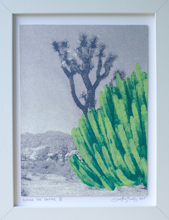 Behind the cactus