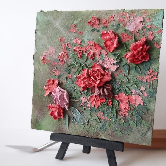 Miniature pink roses. A small floral botanical relief. 3d painting of spring flowers with ceramic petals.