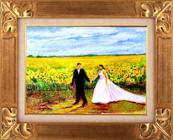 Newlyweds in a romantic Sunflower field