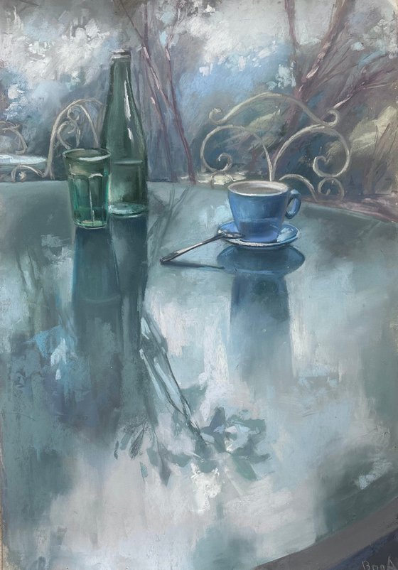 still life with a green bottle and a cup of coffee