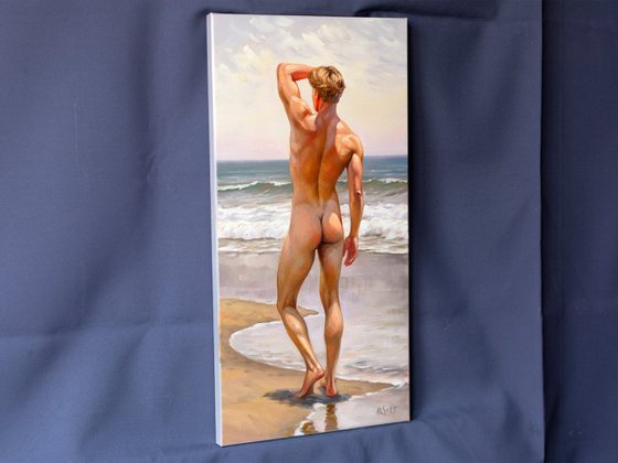 NUDE MAN BY THE SEA