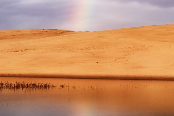 A rainbow over the dune