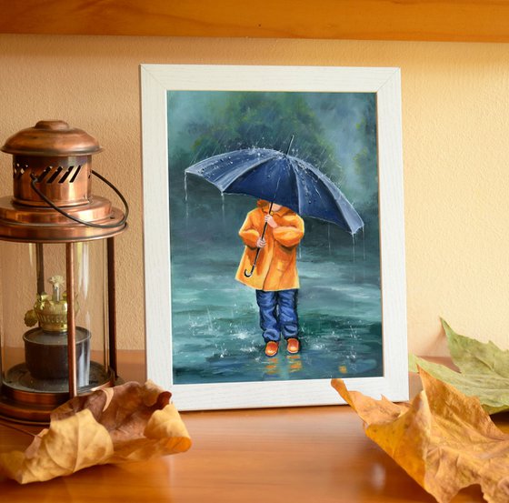 Child with umbrella on a rainy day