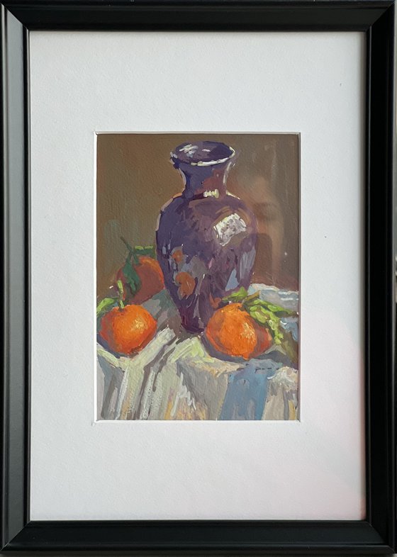 Oranges with a purple vase