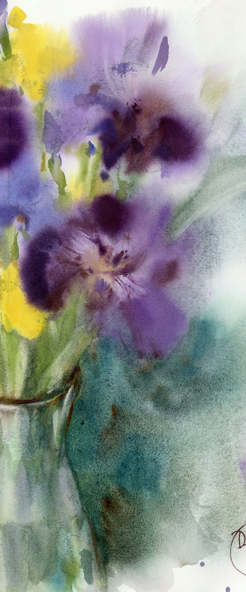 Bouquet of purple and yellow irises in a glass vase. by Tatyana Tokareva
