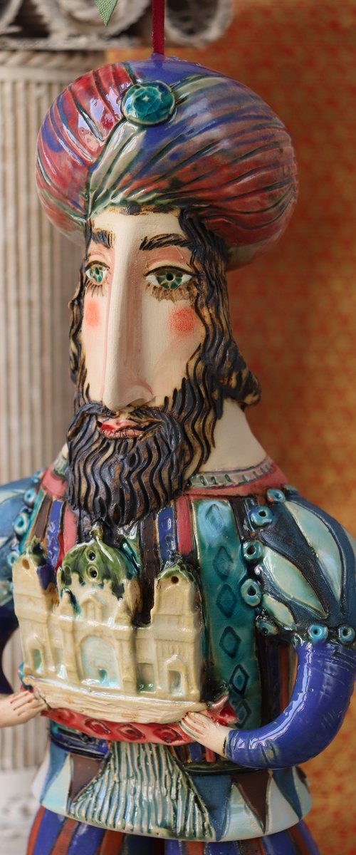 Oriental king holding a cathedral in his hands. Hanging sculpture, Bell-doll by Elya Yalonetski