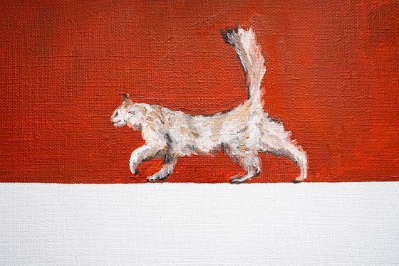 Playful White Cat on Red