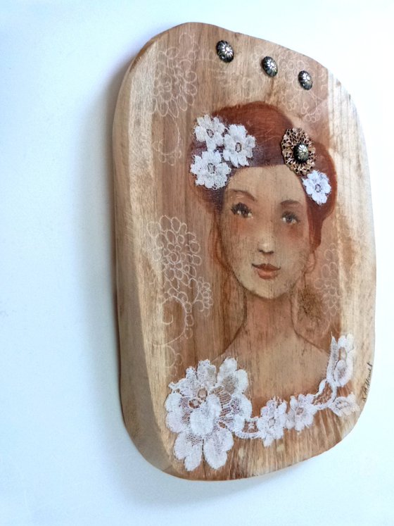 Tender Emilia on wood.