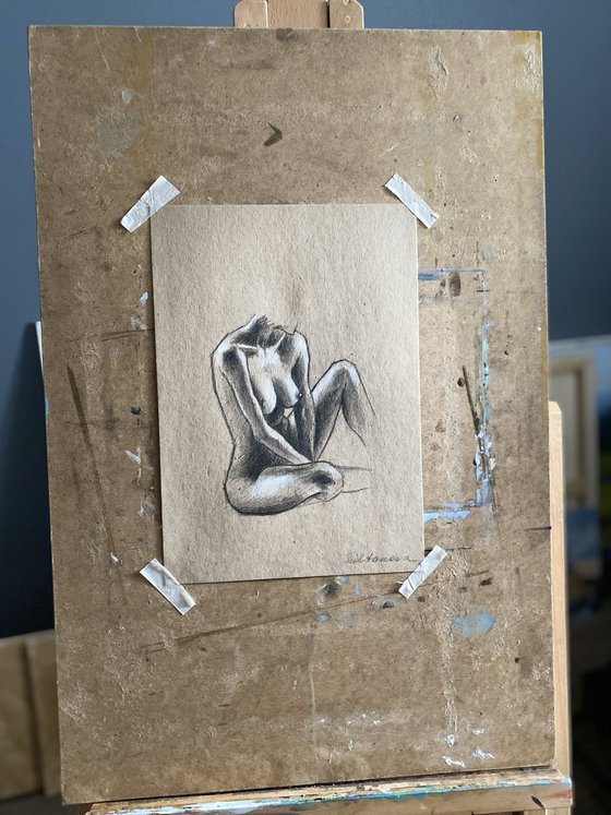 Nude sitting woman