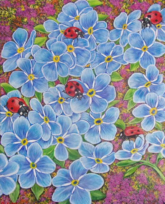 Ladybugs on forget-me-nots flowers