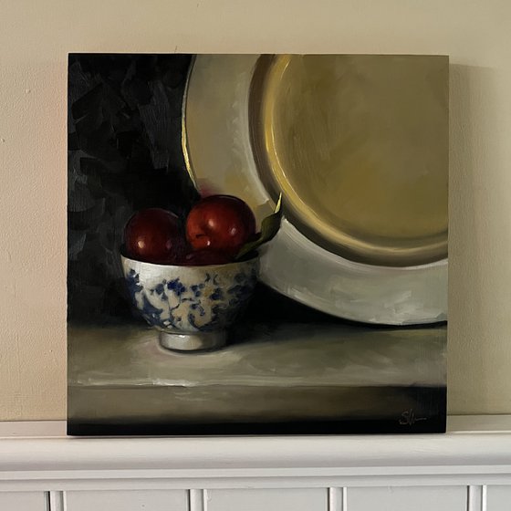 Plums and gold plate.