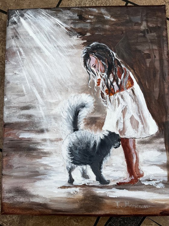 Little girl with a black cat.