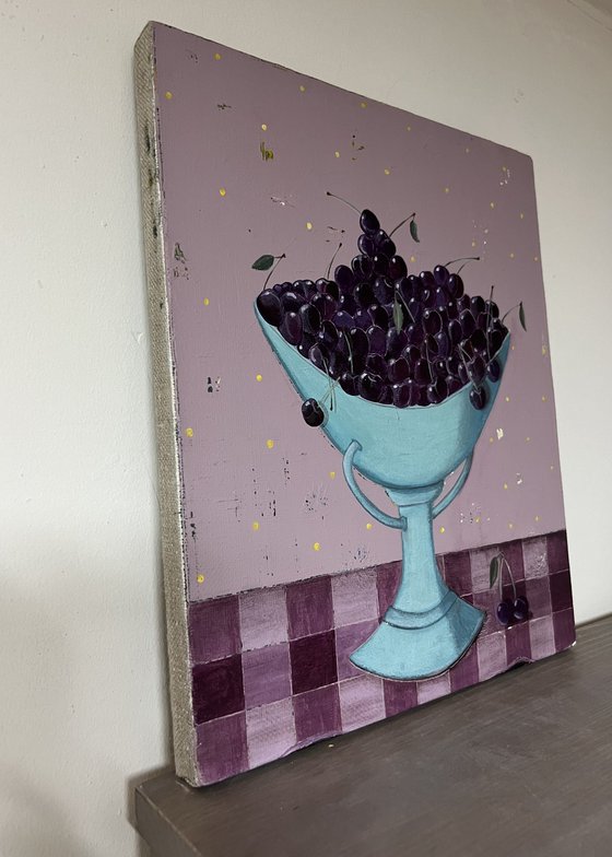 A vase with cherries