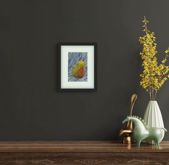 Green pear on blue