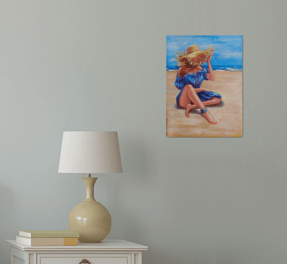 Woman in hat on beach