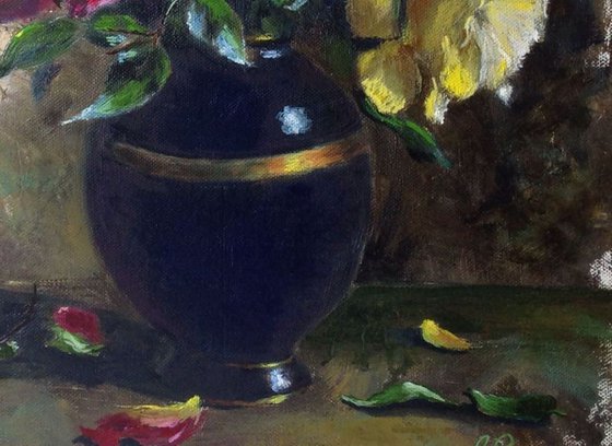 Vase with roses - pink and yellow roses in a blue vase