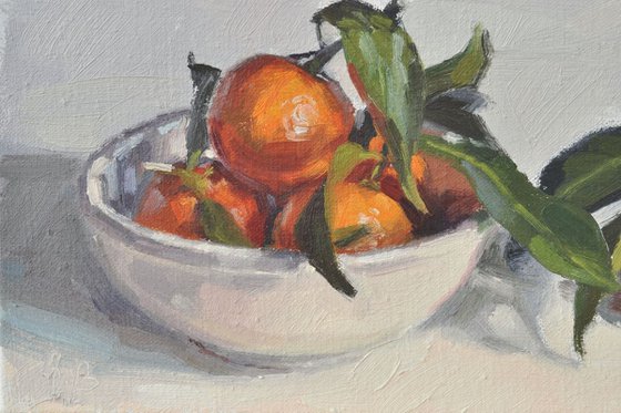 Clementines in a white bowl