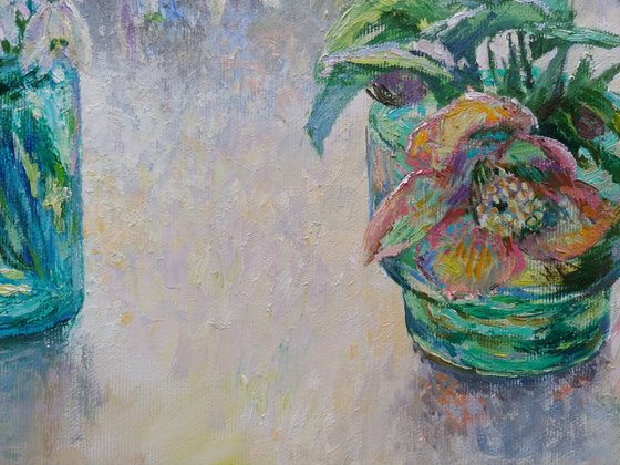 Flowers in blue glass