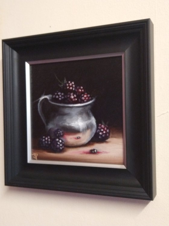 Silver cup with blackberries still life